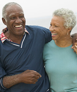 Middle-aged couple with arms around each other