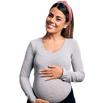 Smiling pregnant woman holding stomach