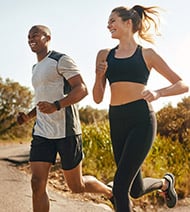young couple running outdoors