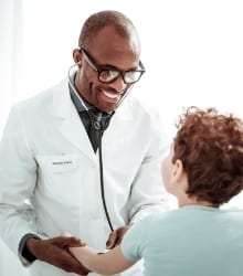 Doctor examining child