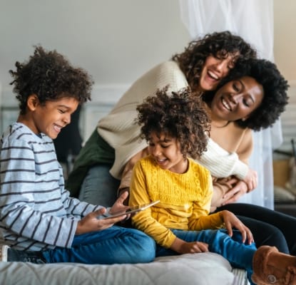 Family looking at tablet together