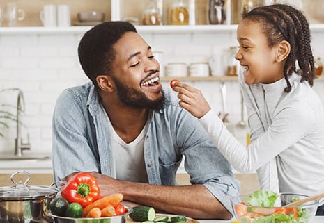 father and child in kitchen