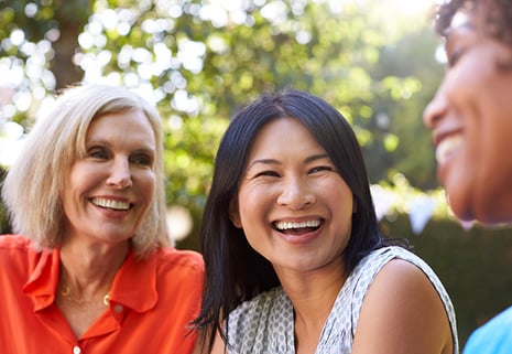 Women laughing in conversation