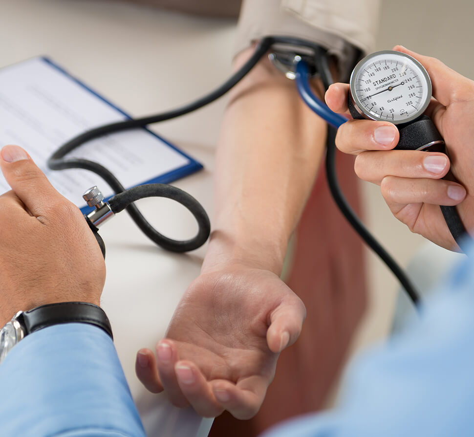 physician taking patients blood pressure