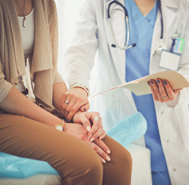 doctor comforts woman
