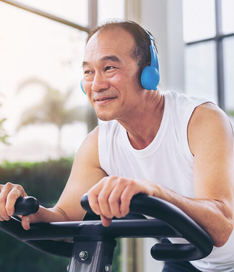 Man riding exercise bike
