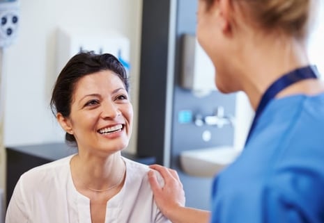 Doctor with hand on patient's shoulder
